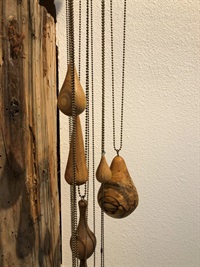 Jennifer Justice, "Bucket of Rain", 2017 Ball chain, eye hooks, twine, found iron spout, wood (cherry, pecan, walnut, elm, and maple)