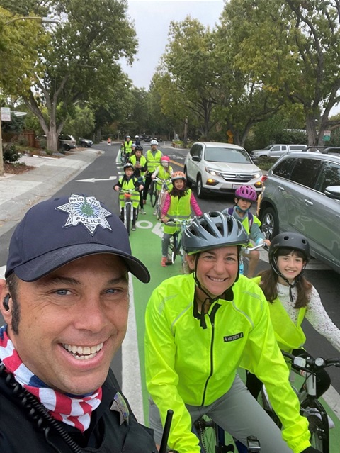 the image has palo alto children learning about bicycle safety through the bike rodeo program.
