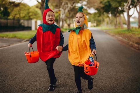 Children in Halloween Costumes trick-or-treating