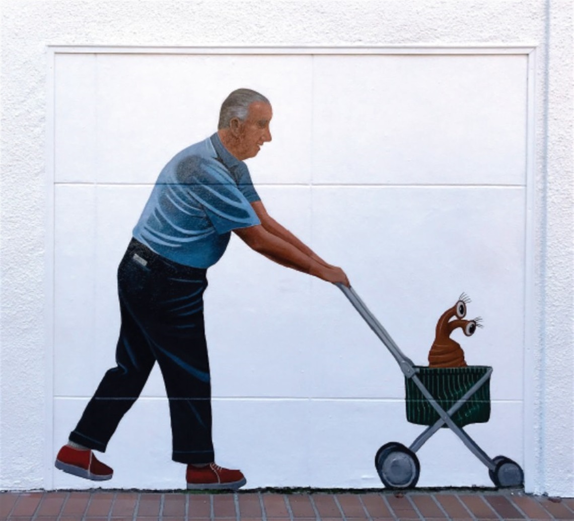 Image of Man Pushing Cat in Stroller, Greg Brown