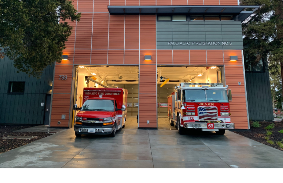 Fire station with an ambulance and a fire truck in the bay